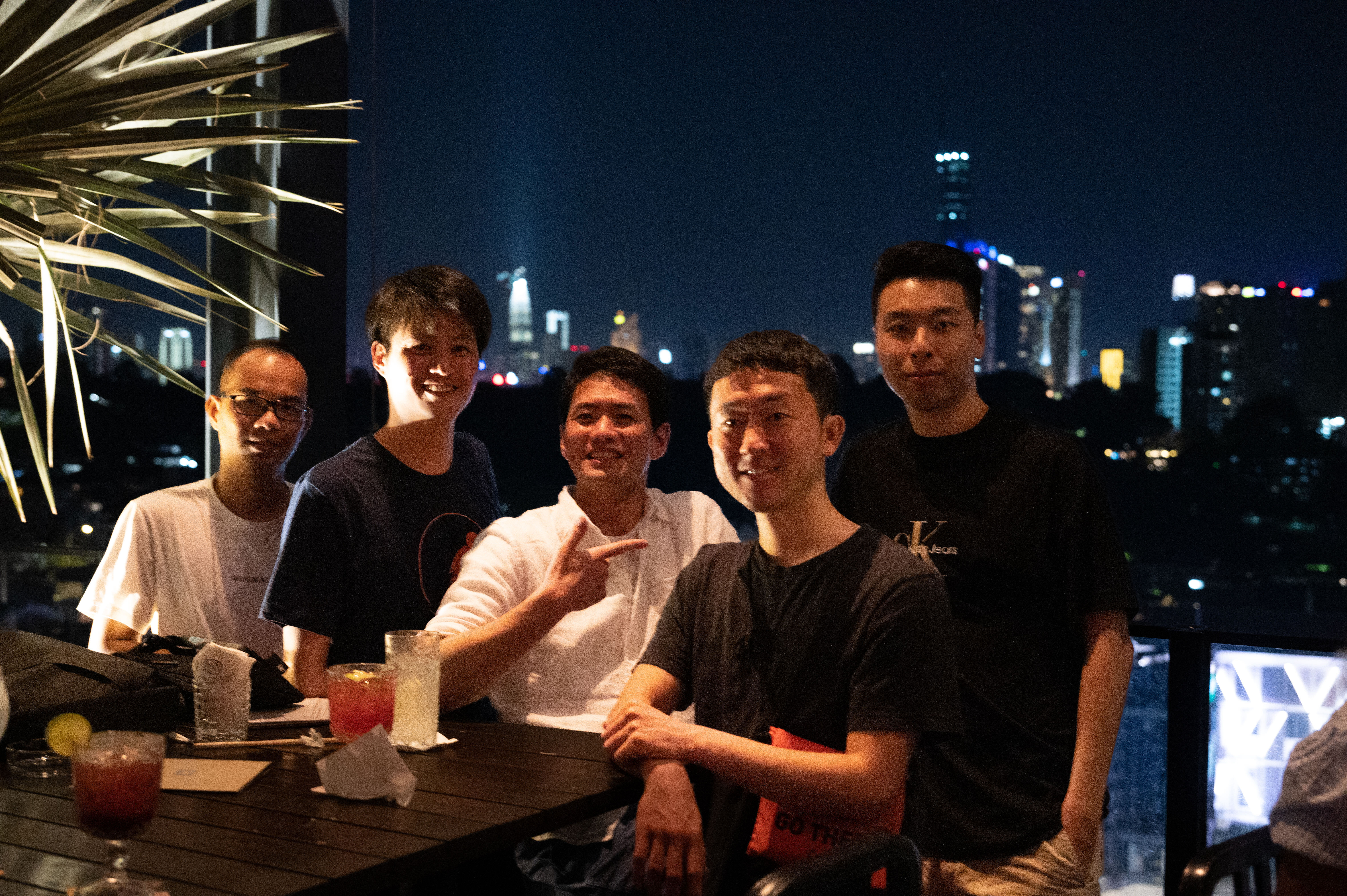 Group photo in night bar overseeing KLCC
